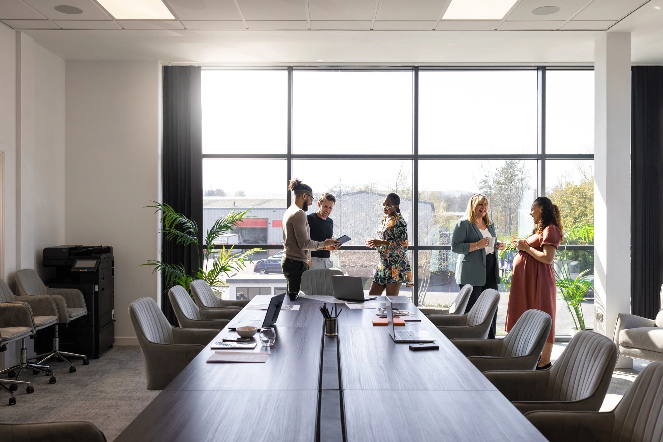 Falconz Techno team meeting in a modern office